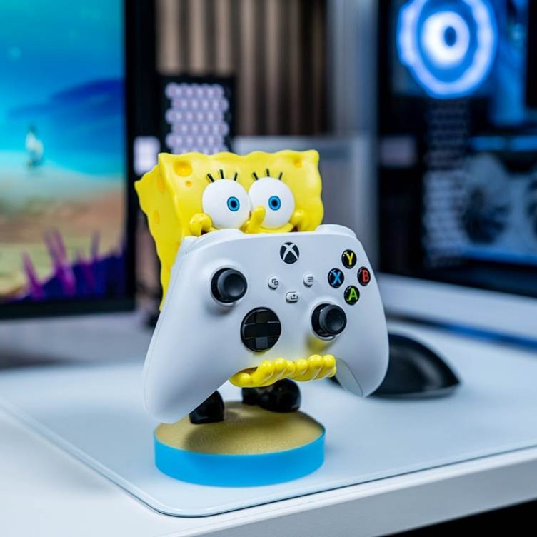 SpongeBob SquarePants plastic controller holder on a PC desk.